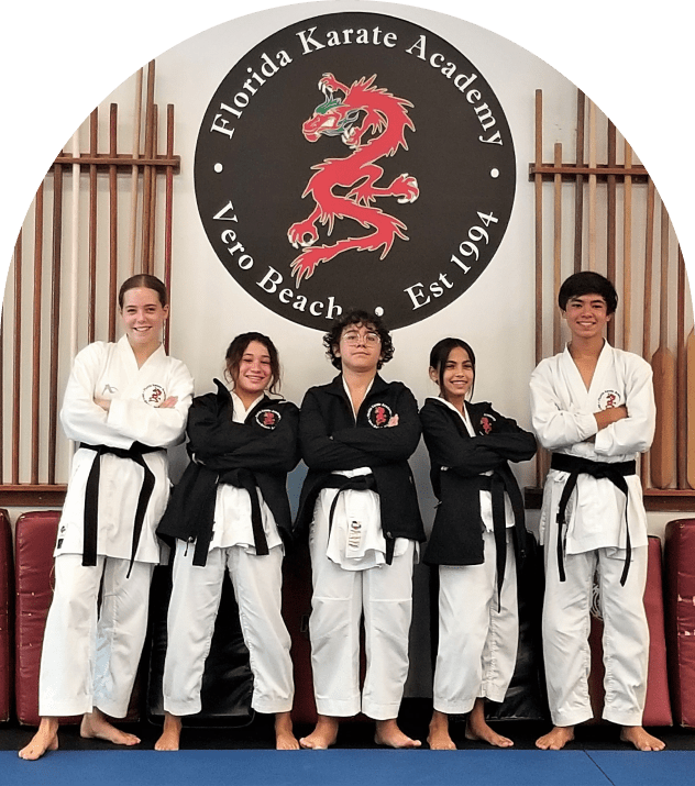 Karate students posing confidently in dojo