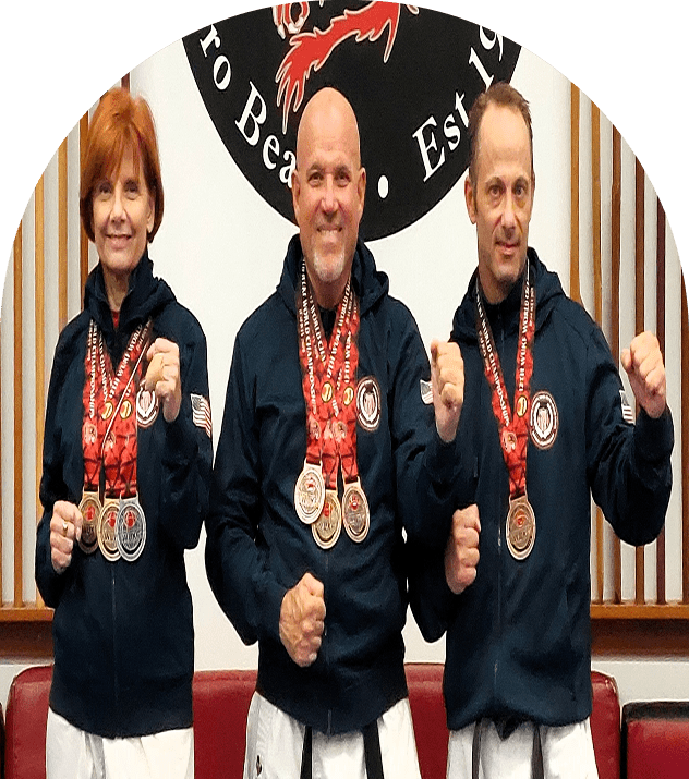 Martial artists proudly displaying medals
