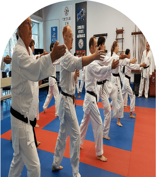 Martial artists in white uniforms