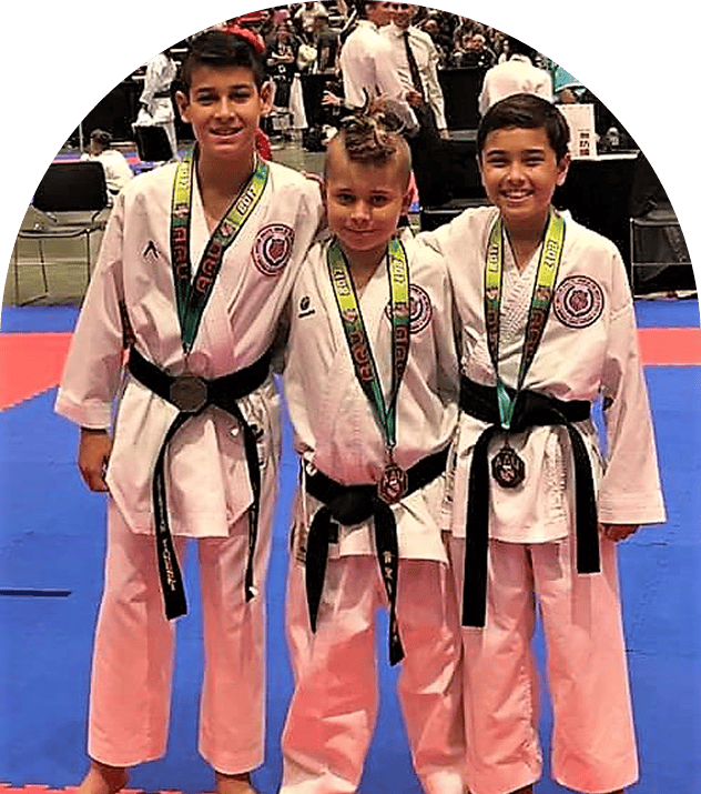 Karate kids smiling with awards