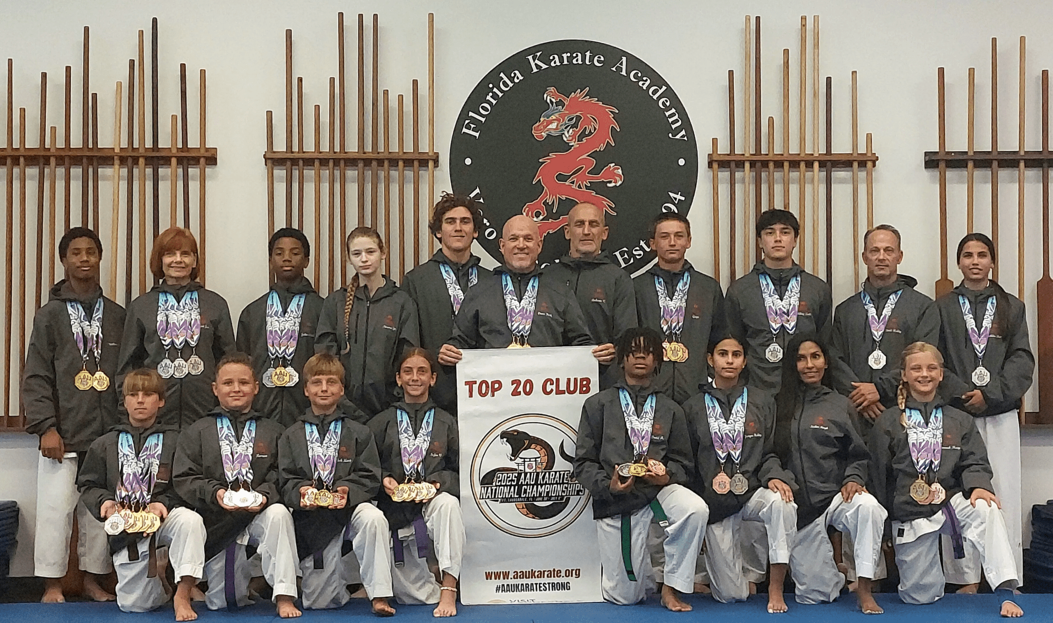 Karate team posing with medals